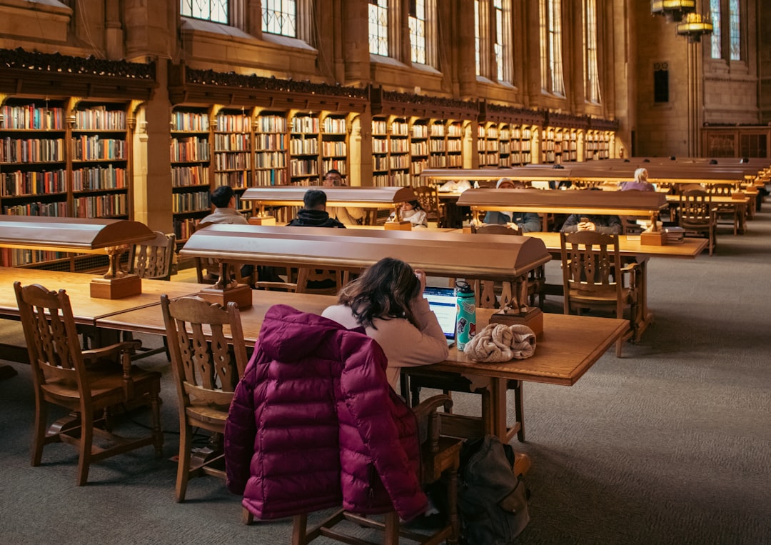 Students study in a beautiful, large library.